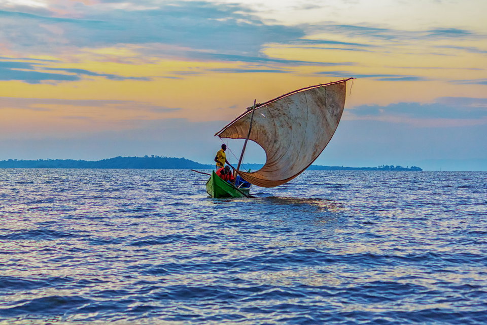 Fishermen on a sail boat set out on Lake Victoria from Seme, Kenya. 
