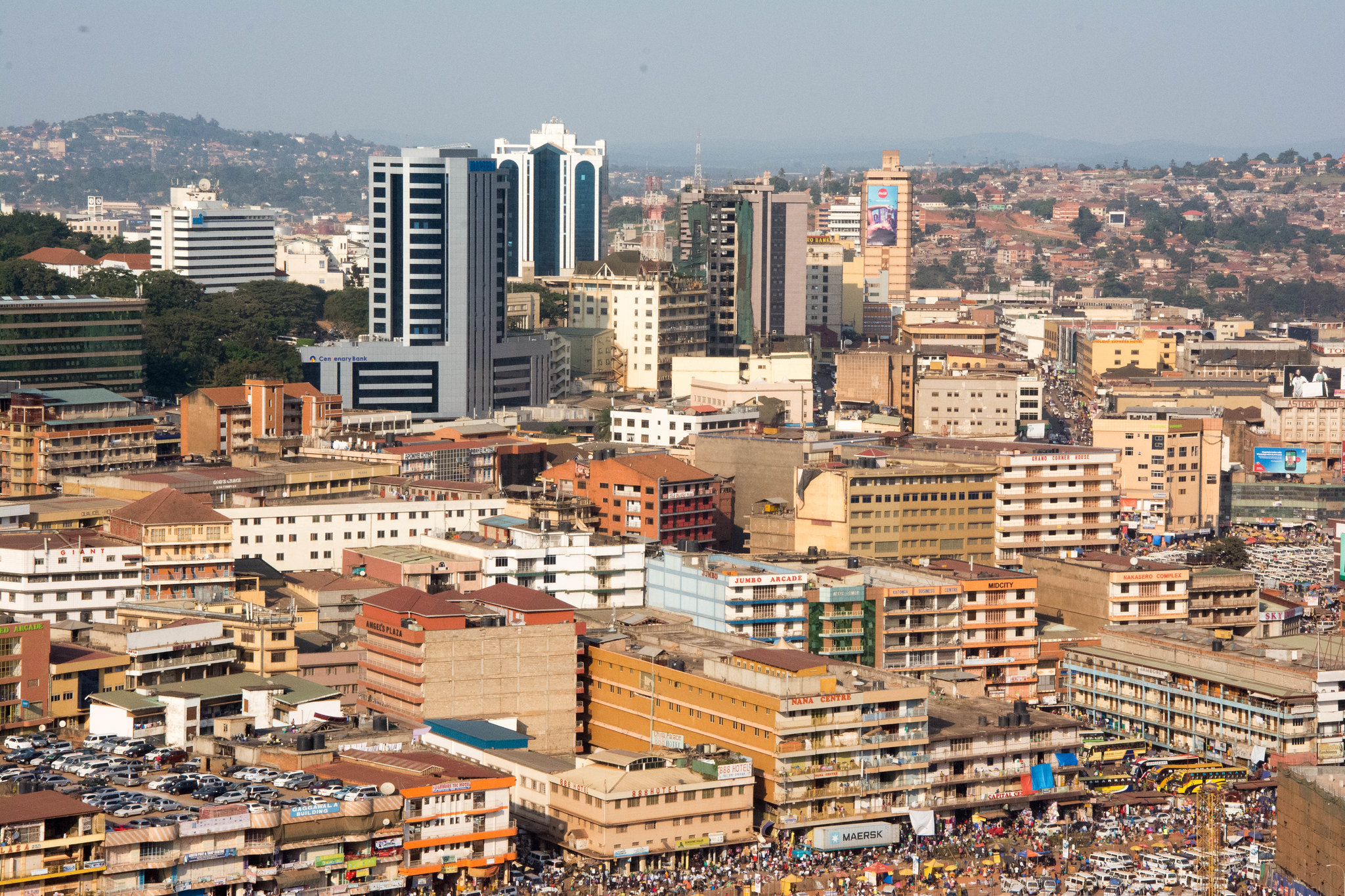 Panoramic view of Kampala city skyline with modern buildings and green hills
