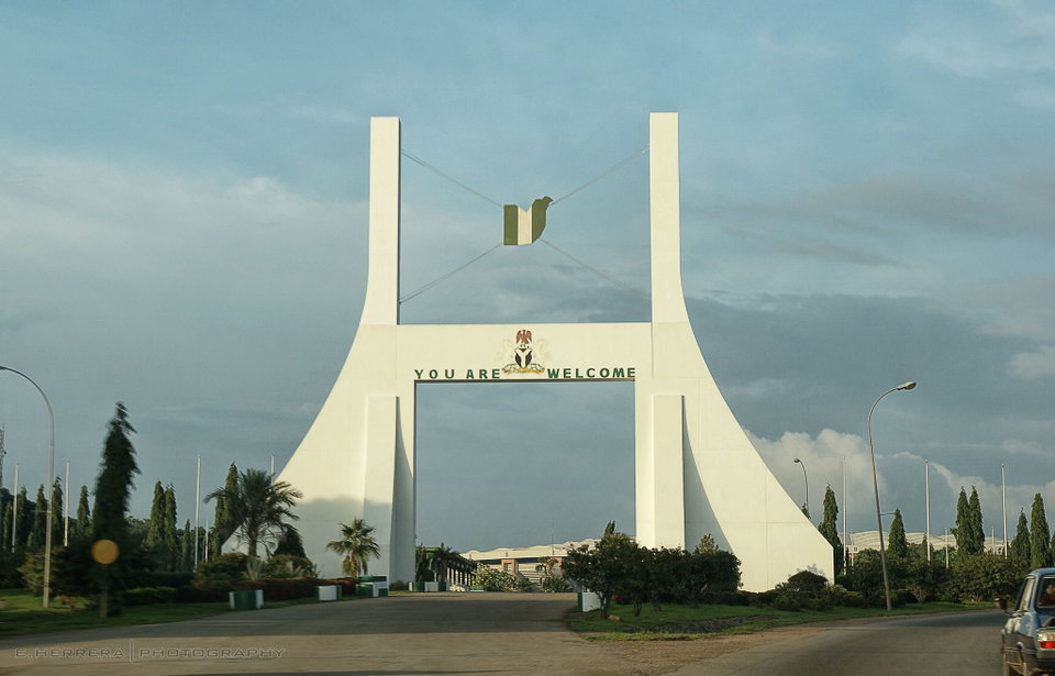 Modern skyline of Abuja showing the Nigerian National Mosque and government buildings