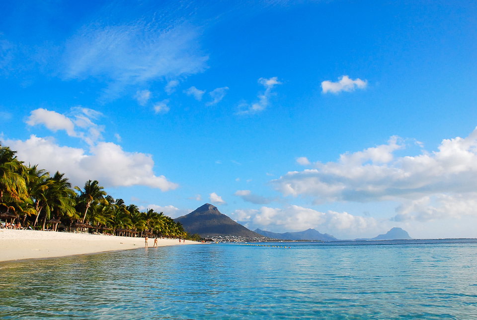 Turquoise lagoon and white-sand beach at Flic en Flac with casuarina trees lining the shore, Mauritius