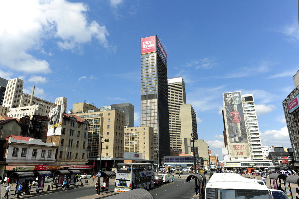 Bustling urban life of Johannesburg from Gandhi Square. Photo by South African Tourism.