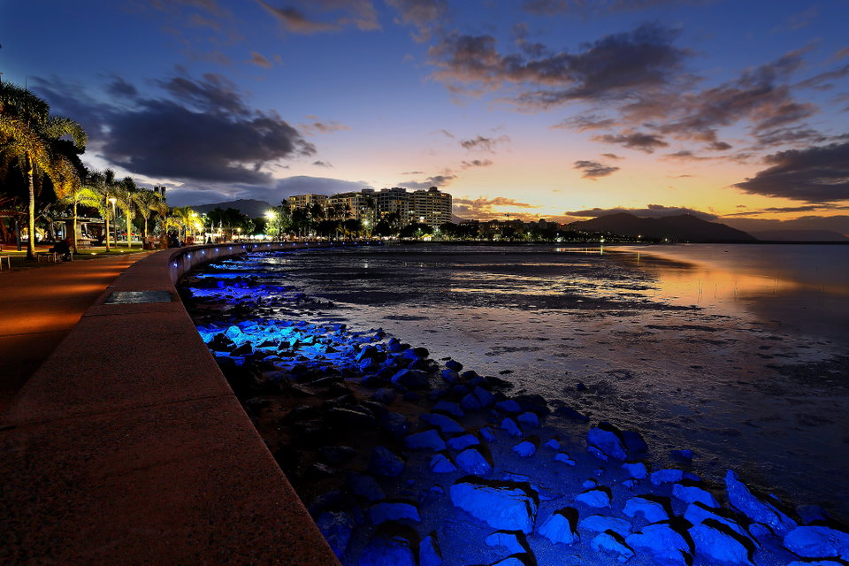 Aerial view of Cairns esplanade and lagoon with the Coral Sea and rainforest-clad hills in the background