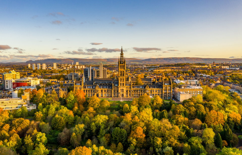 Glasgow city skyline at dusk with the River Clyde in the foreground