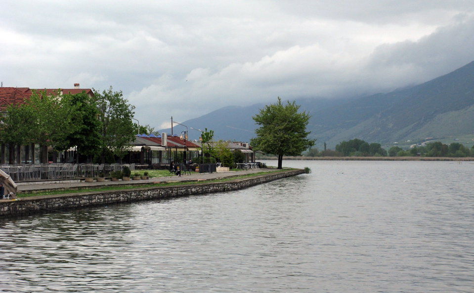 Ioannina old town and the Byzantine castle walls reflected in Lake Pamvotis at dusk