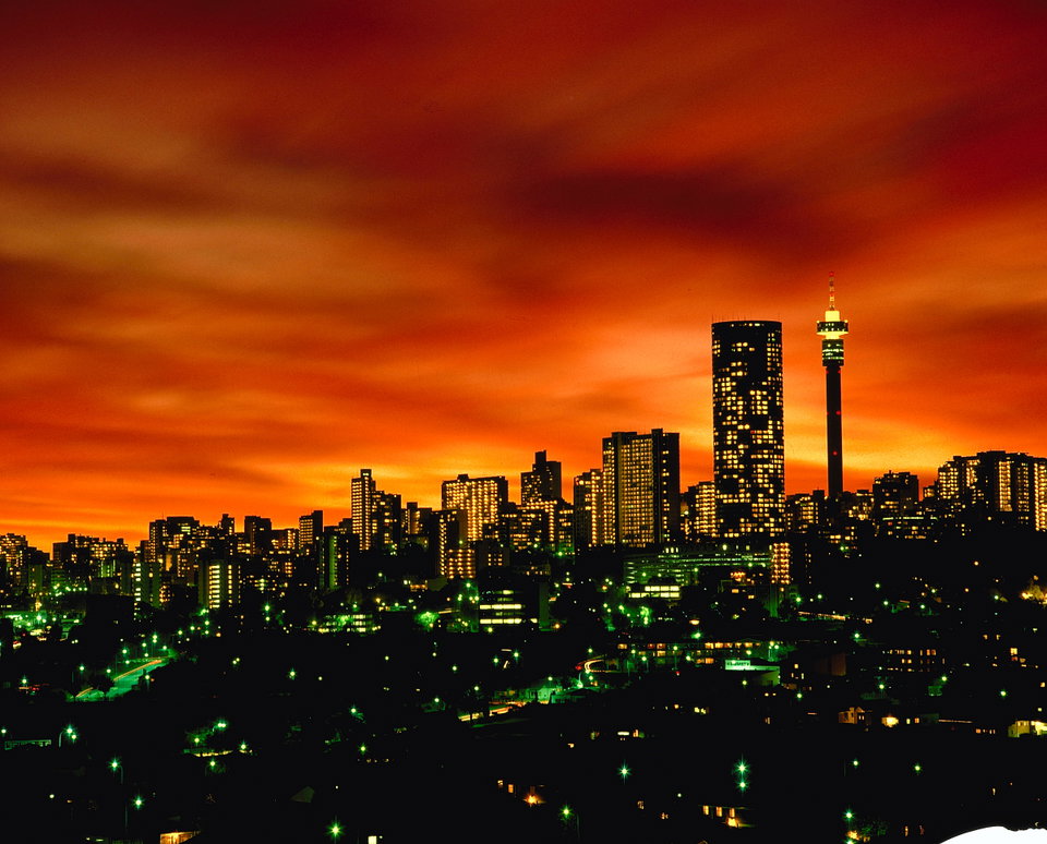 Johannesburg city skyline at sunset with golden light over the urban landscape