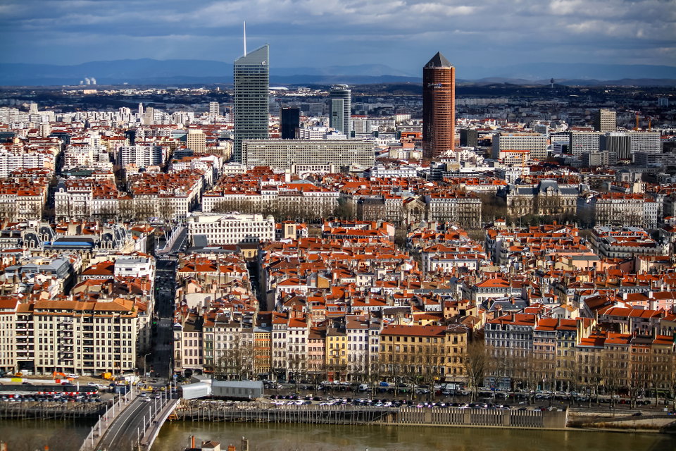 Panoramic view of Lyon at dusk from Fourvière Hill, with the Saône River and illuminated city below