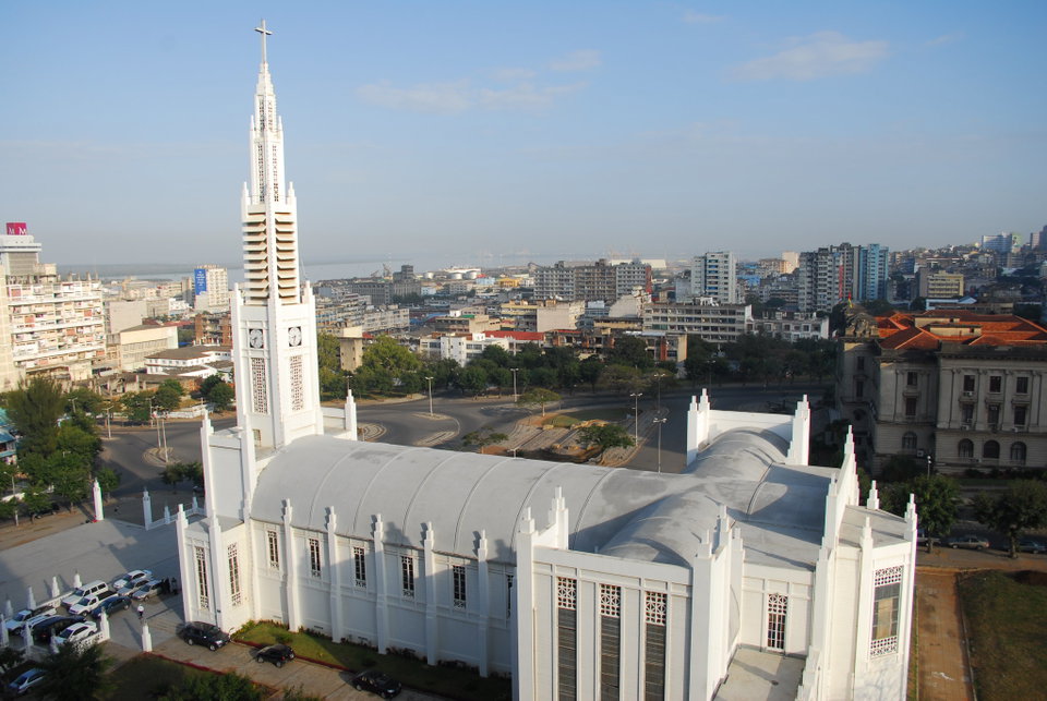 Colourful colonial-era buildings lining a palm-fringed boulevard in central Maputo, Mozambique