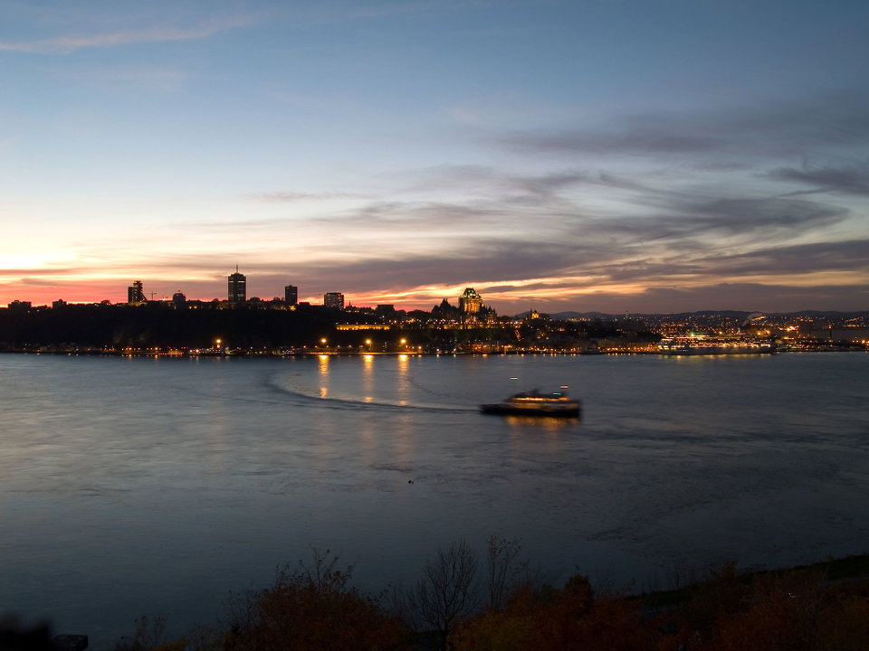 Aerial view of Old Quebec City with the Chateau Frontenac rising above the St. Lawrence River in autumn