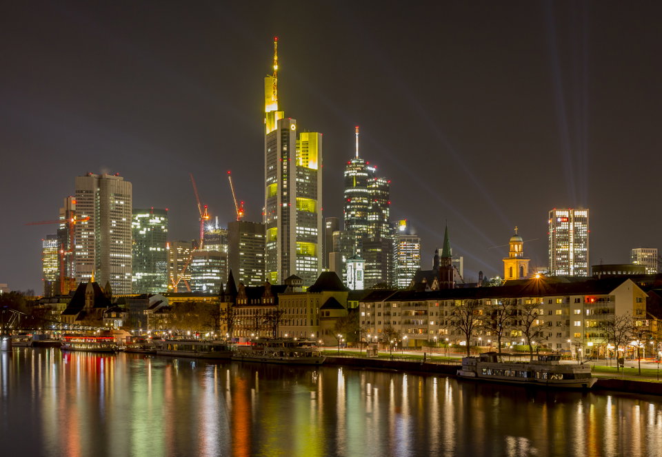 Frankfurt am Main skyline reflected in the Main River at dusk, skyscrapers rising above the Römerberg old town