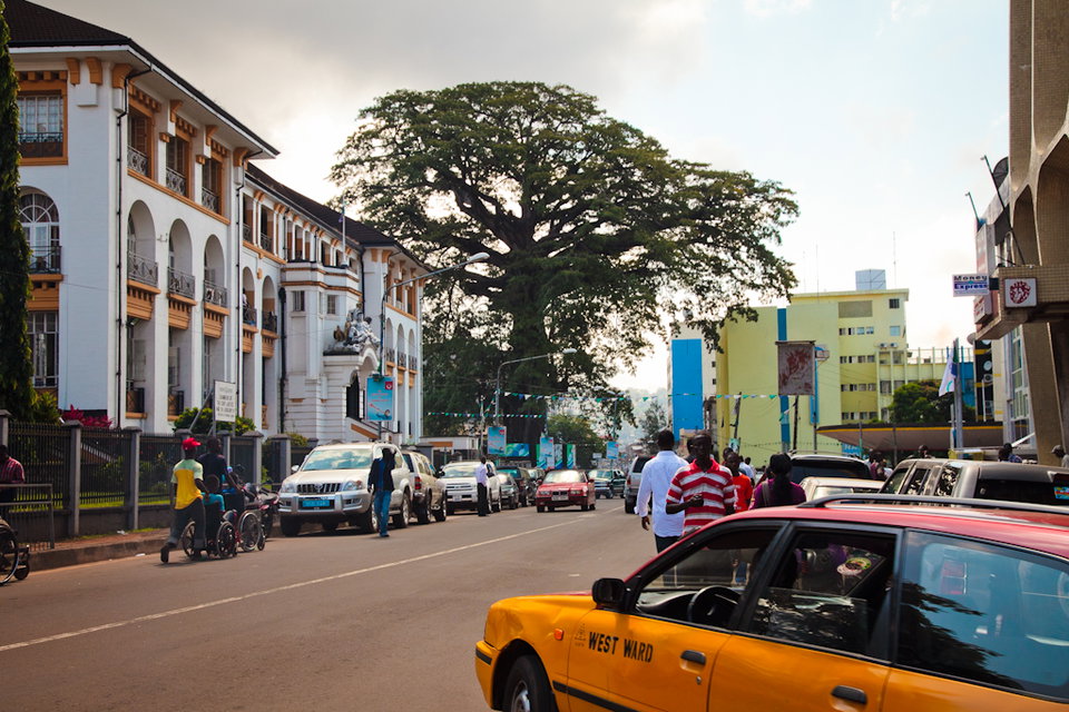 Panoramic view of Freetown's colourful hillside neighbourhoods spilling down toward the Atlantic coast, Sierra Leone