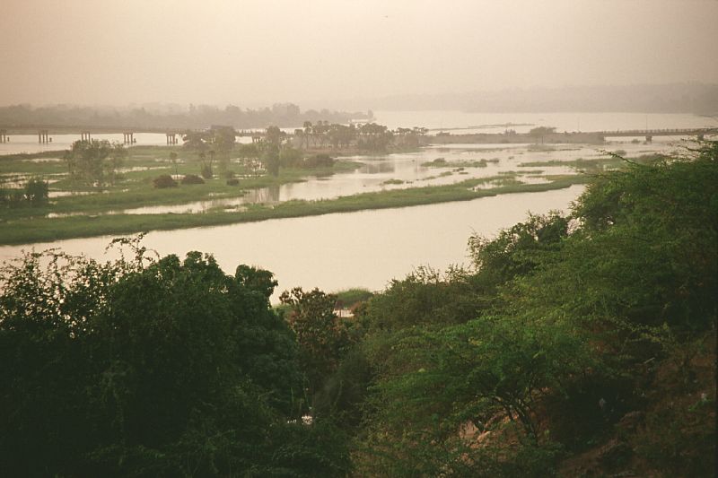 Aerial view of Niamey's skyline along the Niger River at golden hour