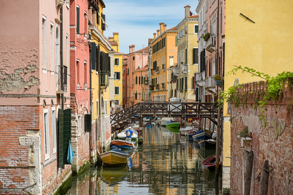 Grand Canal at golden hour with gondolas and the Santa Maria della Salute basilica in the background, Venice, Italy