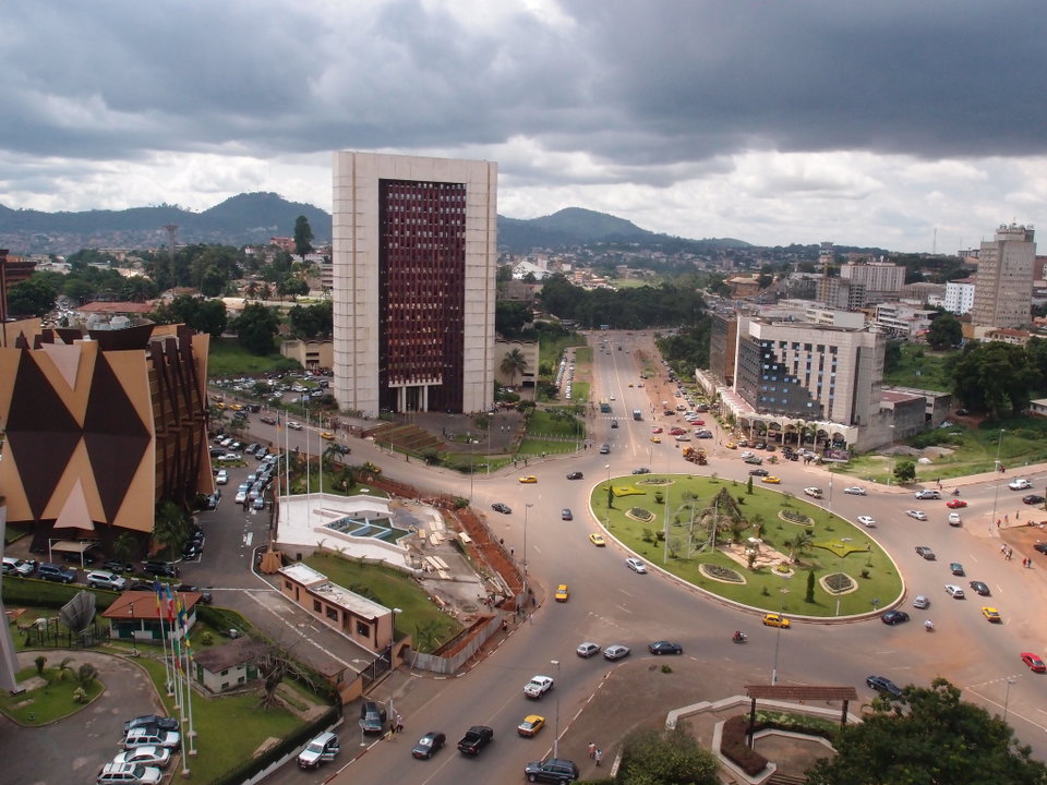 Aerial view of Yaoundé's green hills and cityscape at dusk, Cameroon