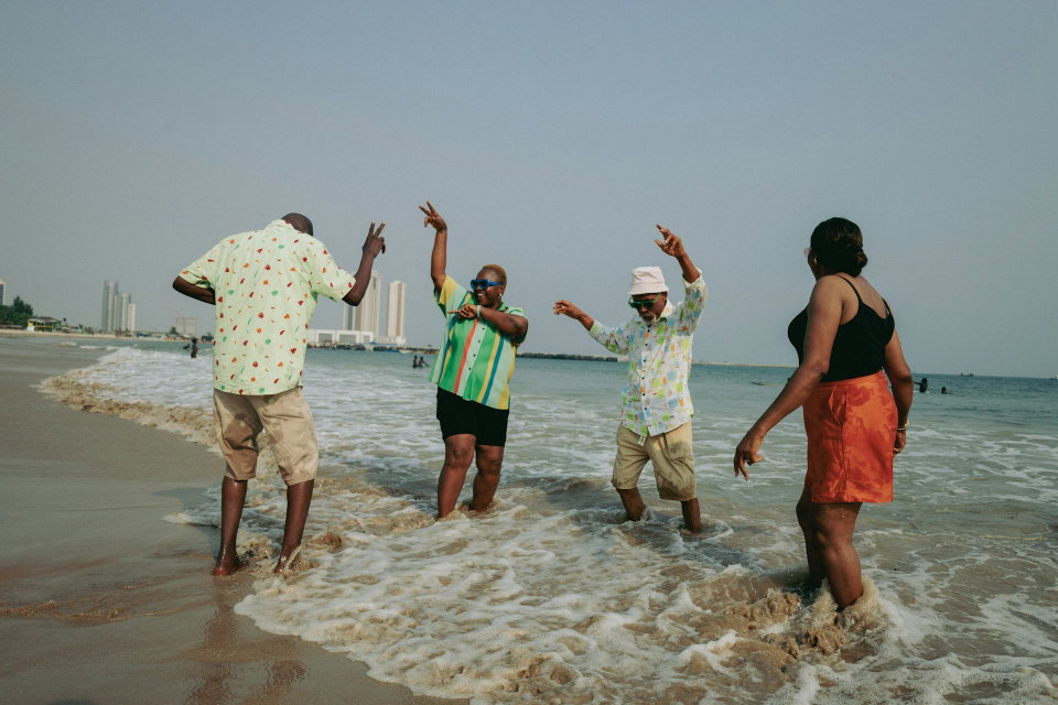 Holiday makers enjoy the waters of the Atlantic Ocean off the coast of Lagos, Nigeria. Photo by Ben Iwara.