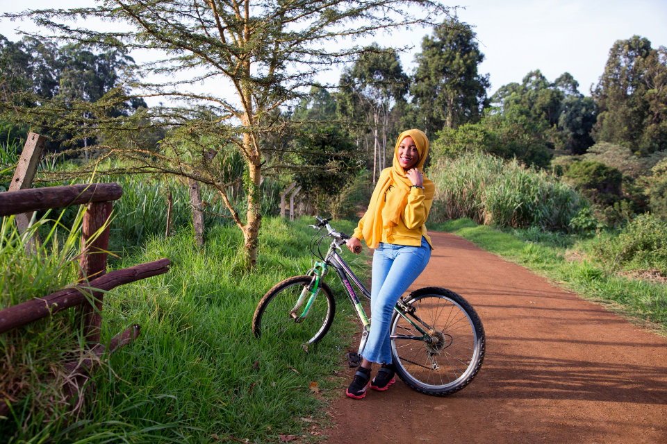 A cyclist poses for a photo at the Karura Forest