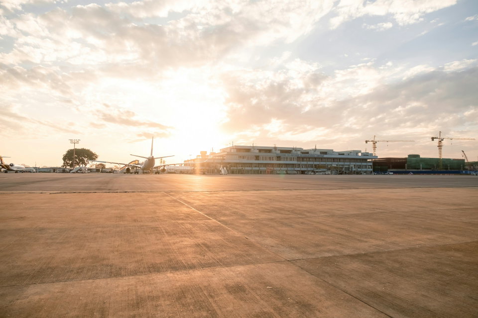 The sun is setting on the tarmac of Entebbe International Airport in Uganda. Photo by Micah Camper. 