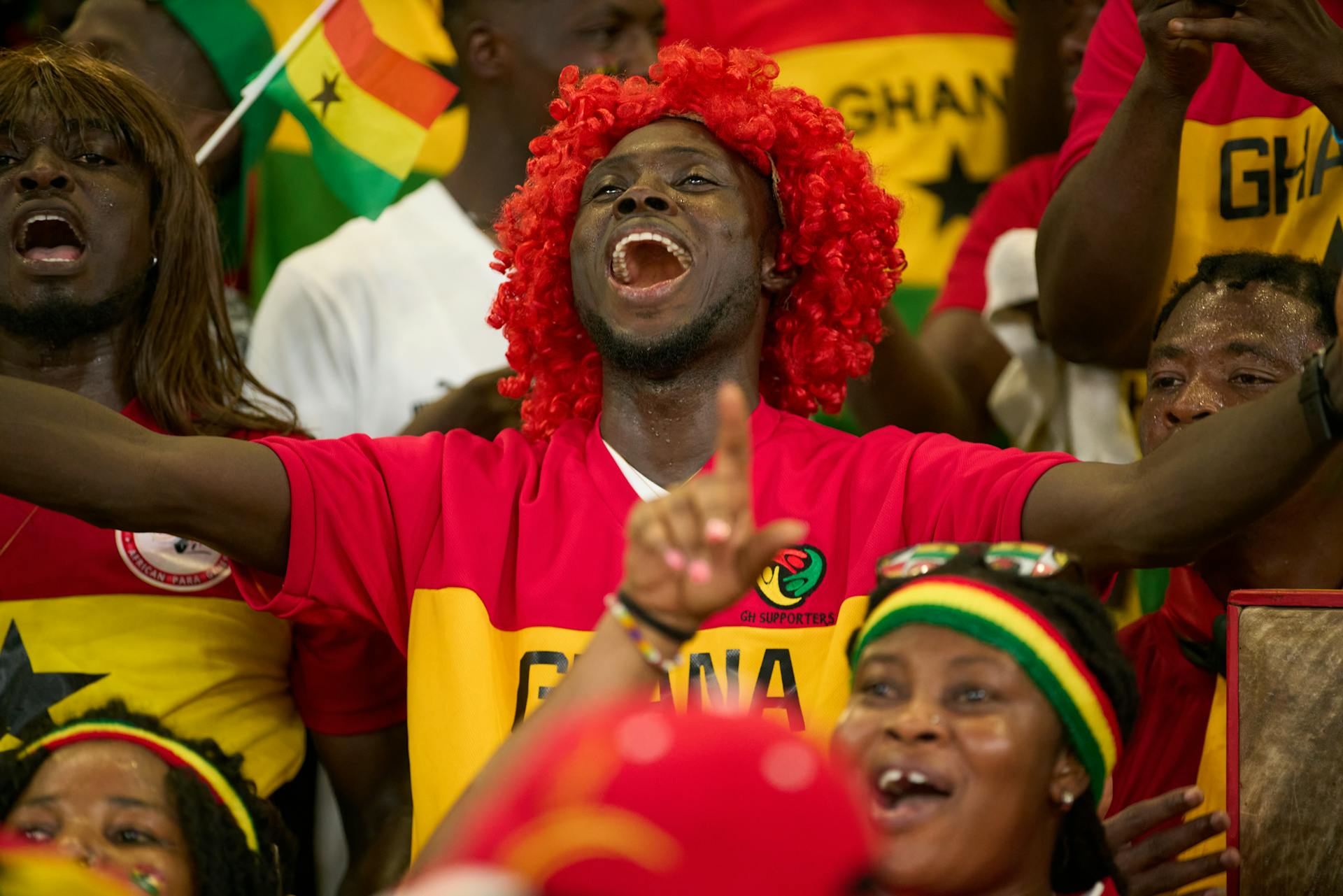 Ghanaian soccer fan sings at a football match. Photo by Adera Abdoulaye Dolo.