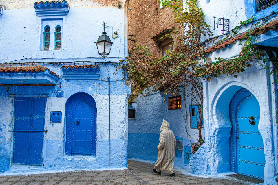 A man walks a village street in Chefchaouen, Tanger-Tétouan-Al Hoceïma, Morocco