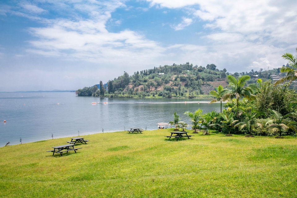 Peaceful landscape of Lake Kivu from Gisenyi, Rwanda, showcasing lush greenery and calm waters. Gisenyi, Western Province, Rwanda. Rwanda Lens.