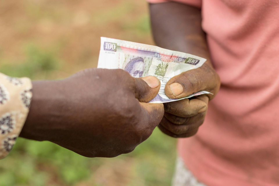 People changing money during a transaction